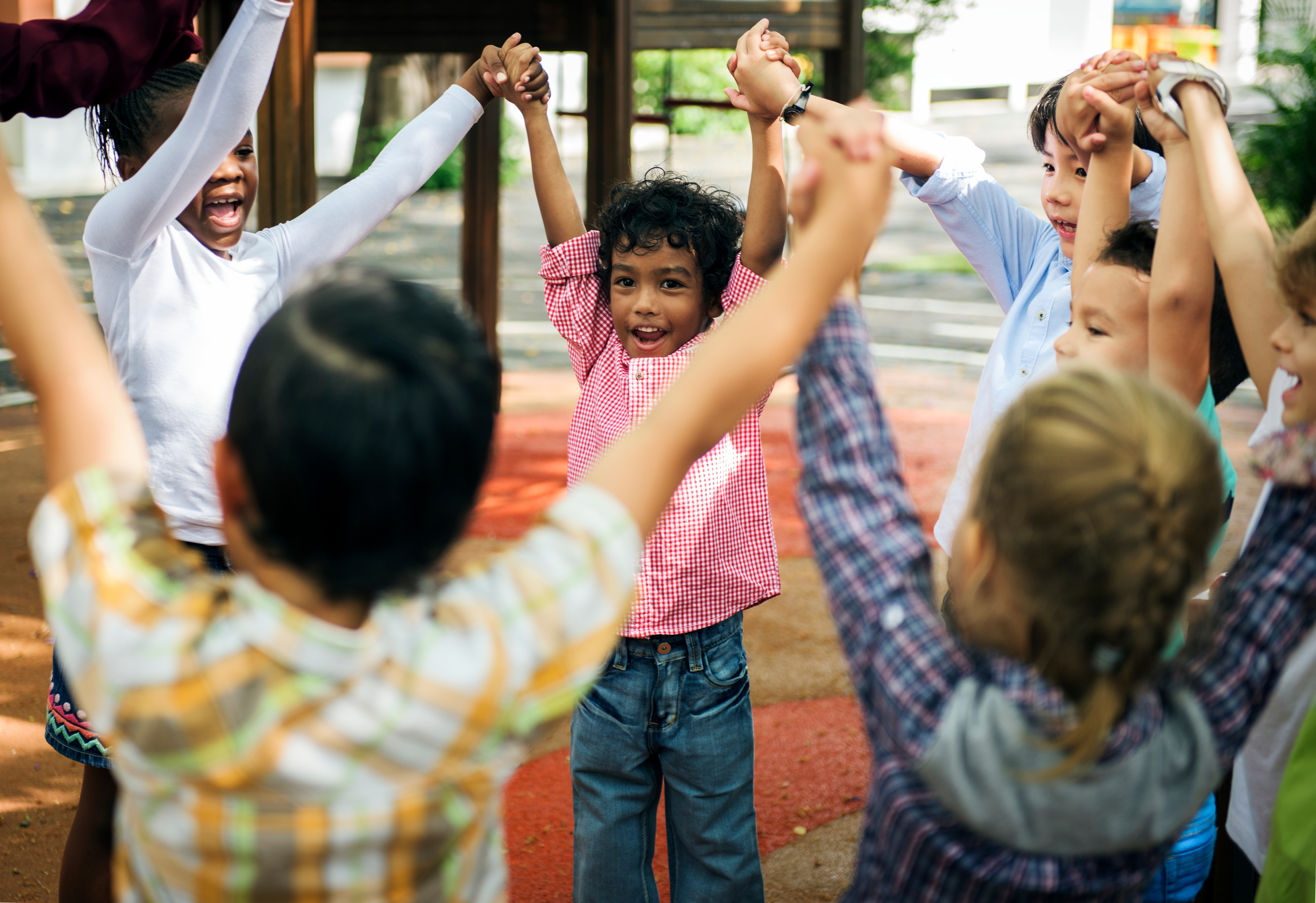 Children holding hands circle