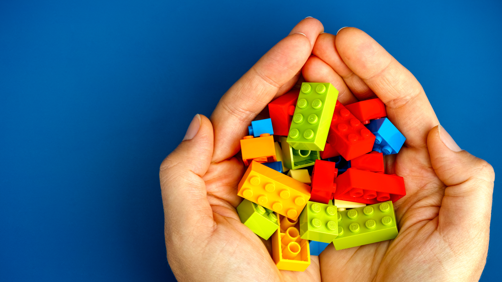 Hands building blocks